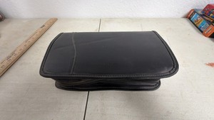 Black Zippered CD & DVD Storage Binder filled with plastic sleeve pages