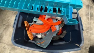 Tub full of Hot Wheels tracks and accessories